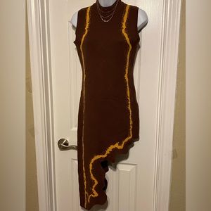 Brown sleeveless dress,half leg, gold strip down on both sides of the dress.